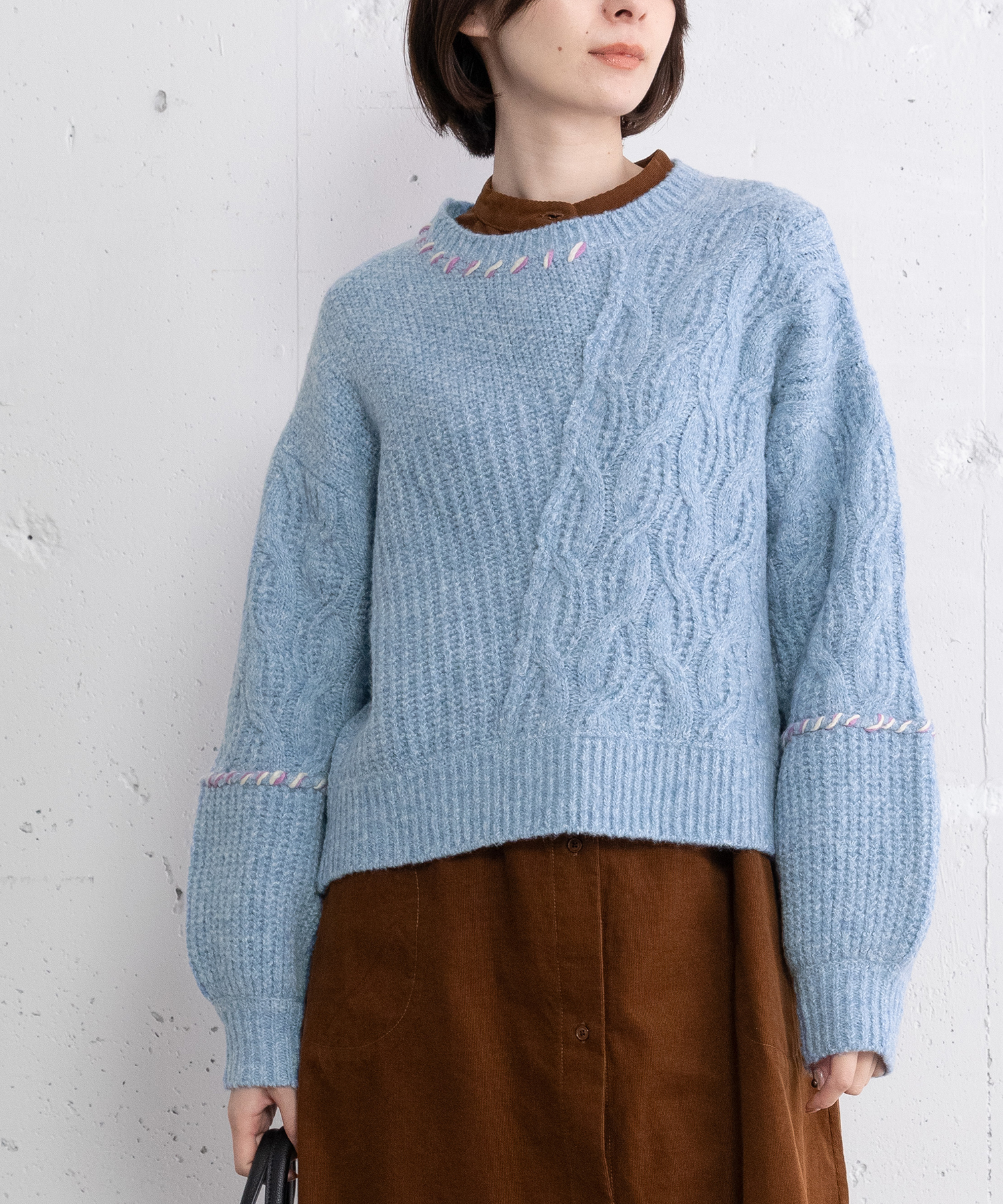 ハンドステッチななめケーブルニット